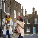 Two women walking together after receiving UK ILR